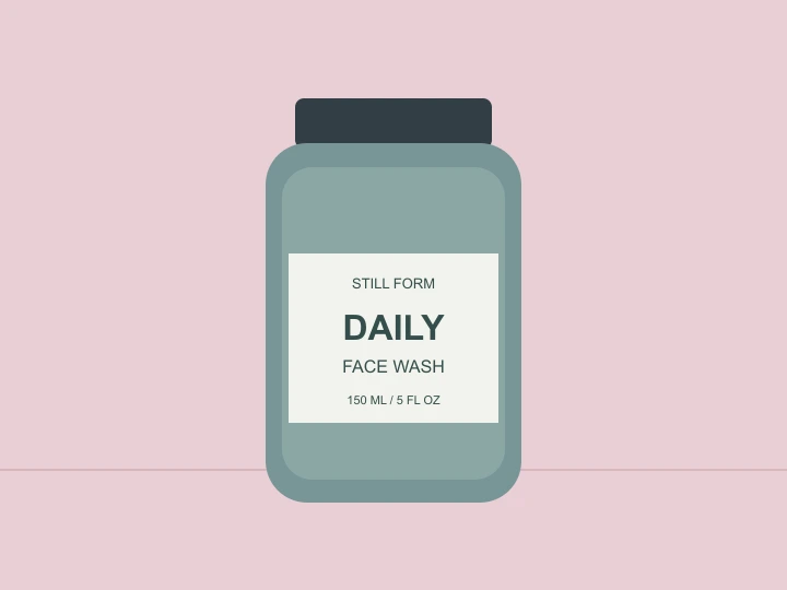 Green DAILY face wash bottle on a pink background